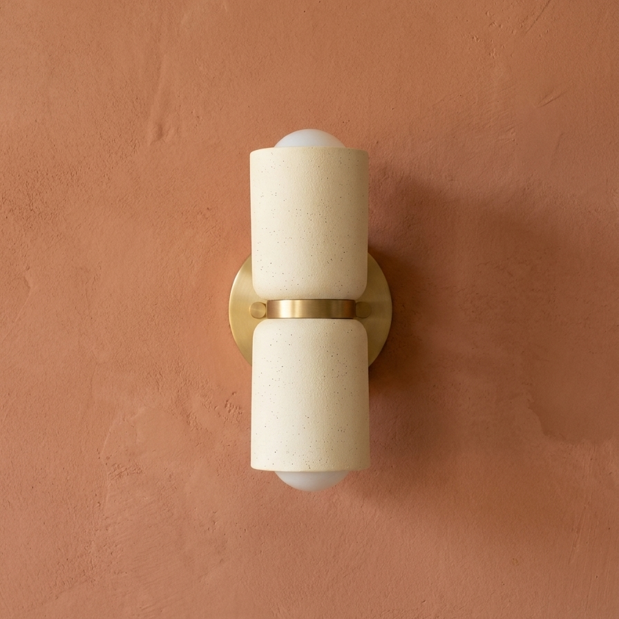 AX163 ceramic wall sconce with brass mount on a terracotta plaster wall, modern up down wall light