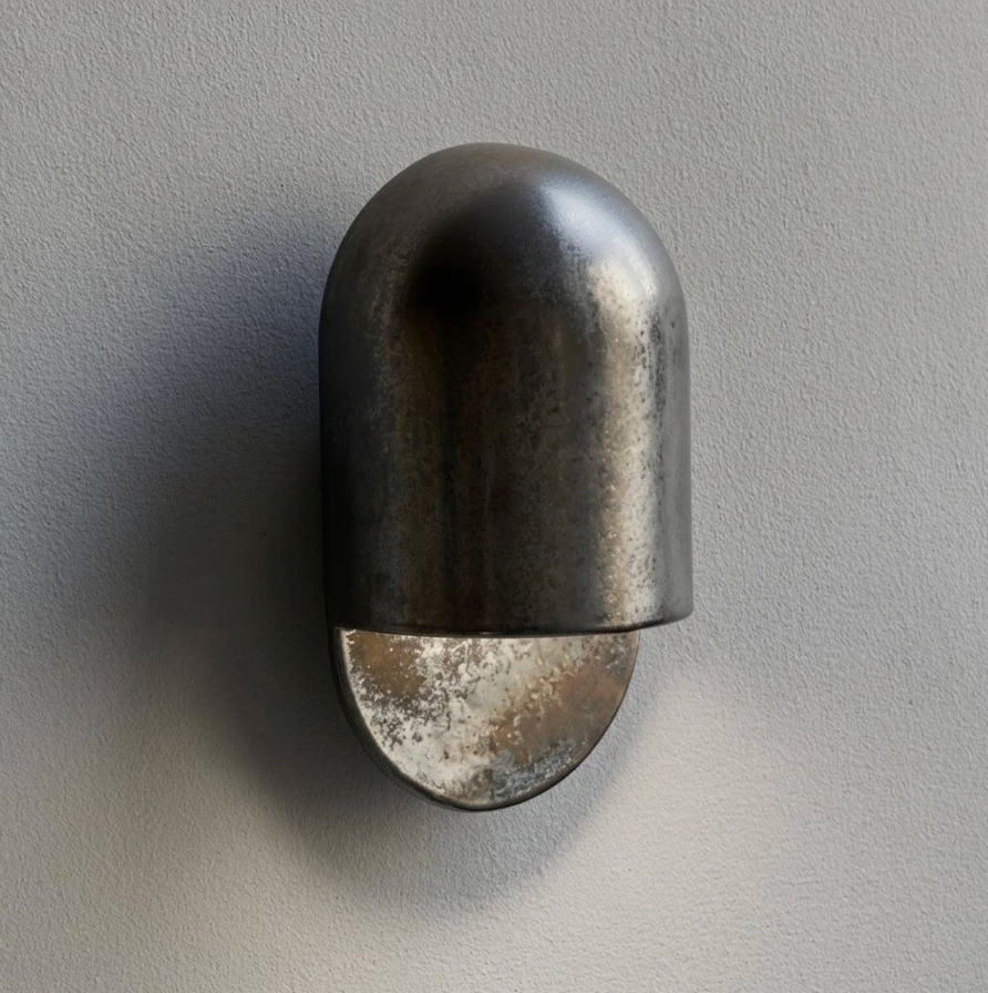 AX472 gunmetal outdoor wall sconce, unlit side view showing the arched hood profile