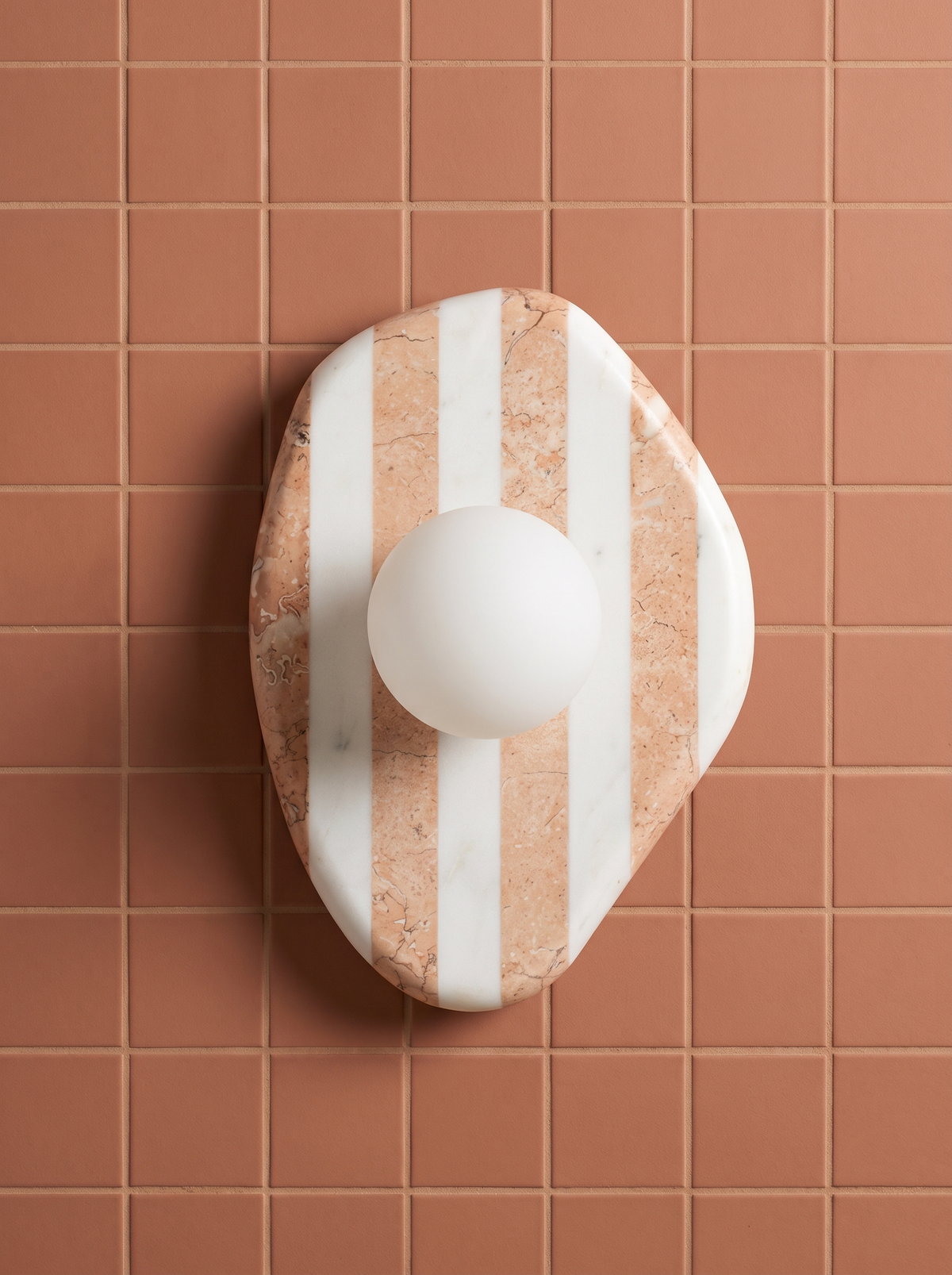 AX200 striped marble sconce on terracotta tile, modern bathroom wall sconce with glass globe